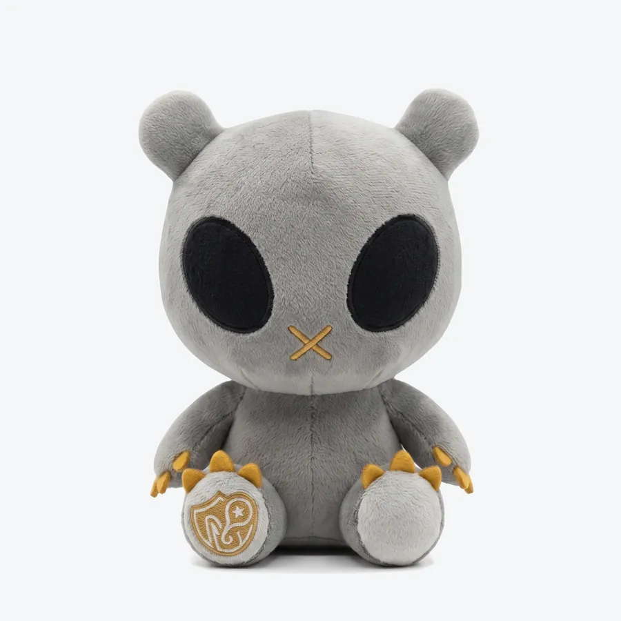 Ravyn, a grey plush toy with golden claws, seen from the front